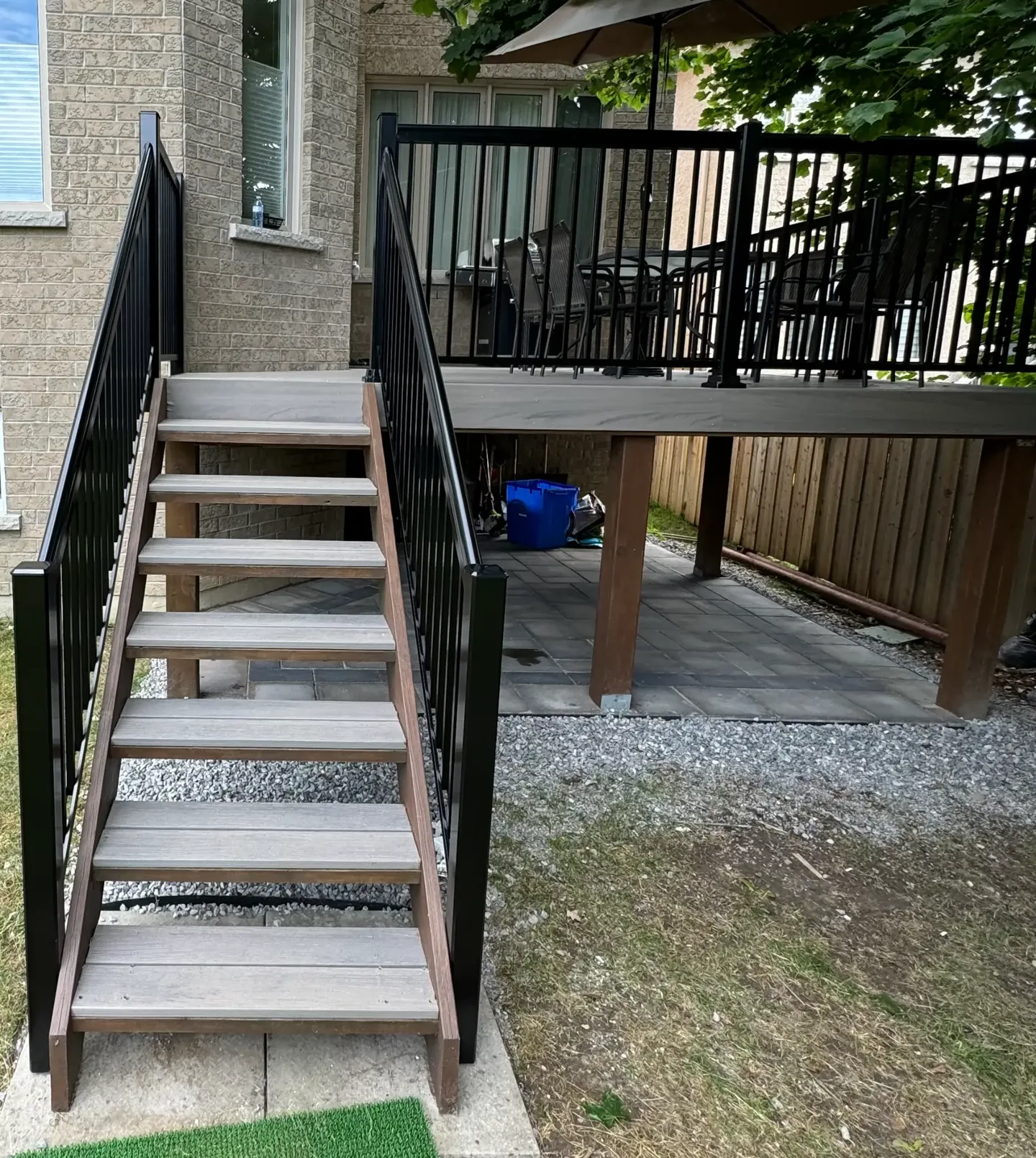 Raised exterior deck with black railing