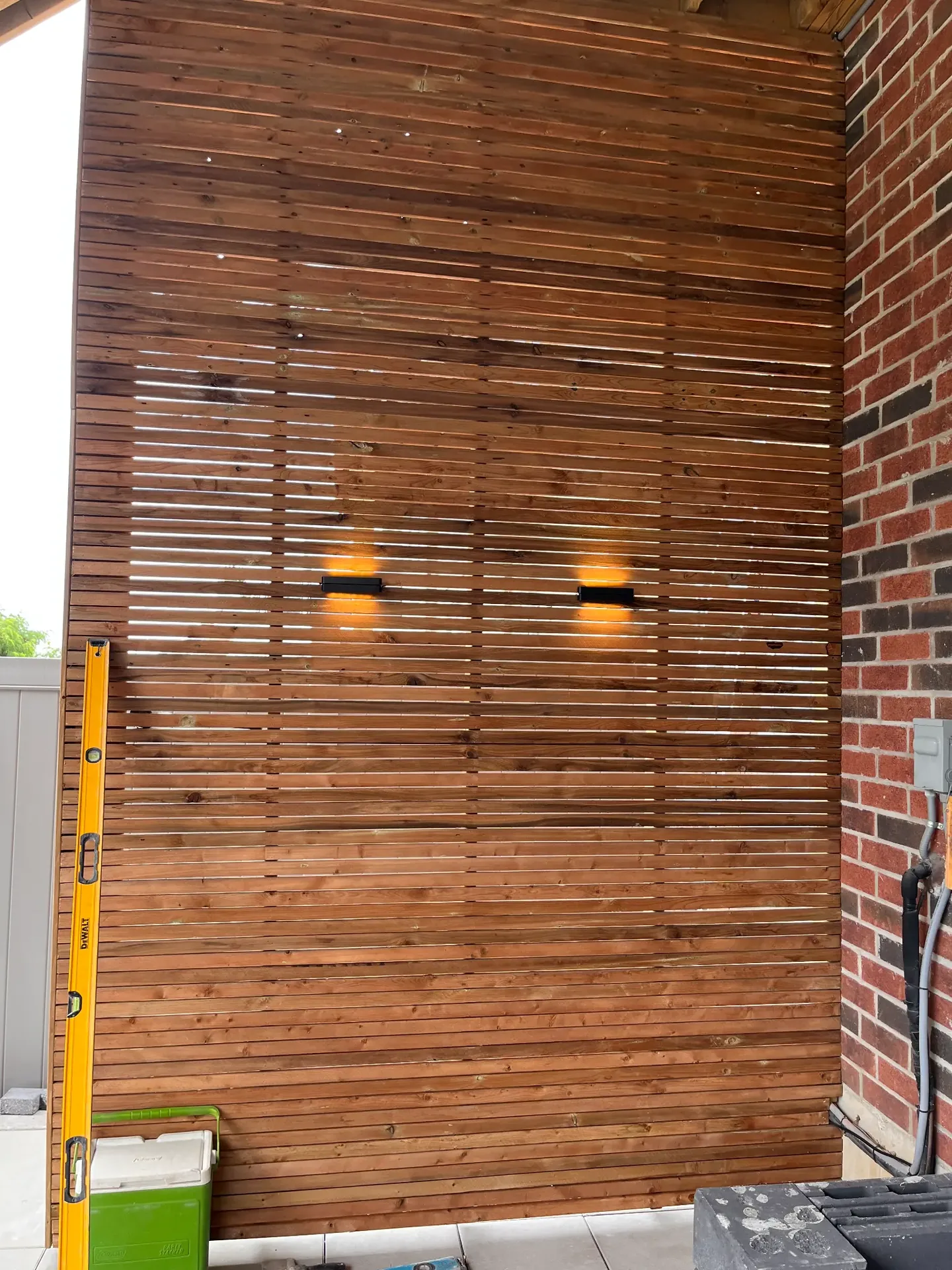 Horizontal wood feature wall beside an exterior entrance