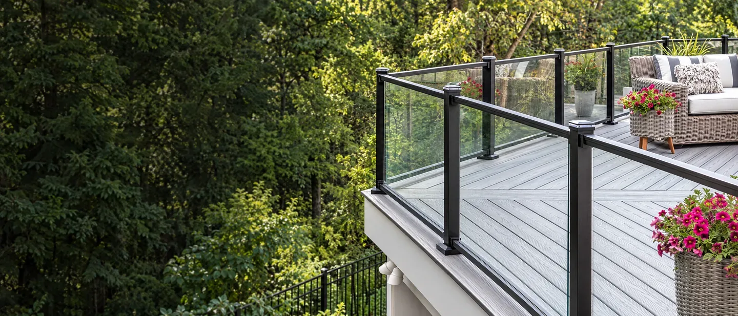 Modern glass railing at a deck edge