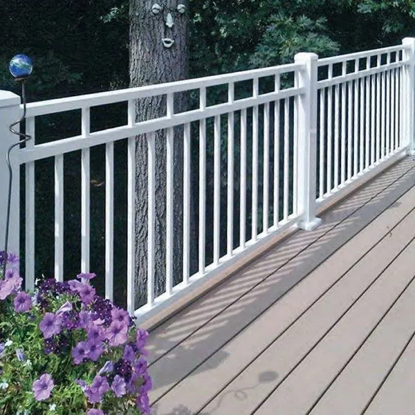 White exterior deck railing beside flowers